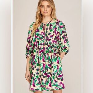 - Multi color dress with poufy 3/4 sleeves. Rich colors and has pockets. N…